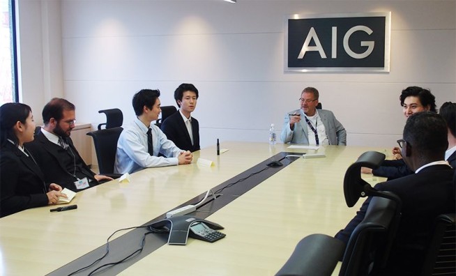 Photo: AIG Japan CEO Robert Noddin (center) with TUJ students