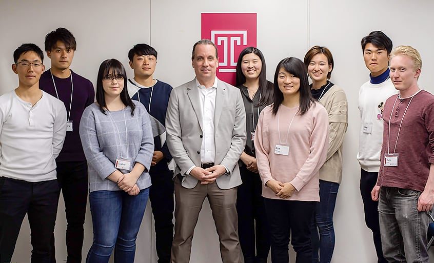 Group photo of students and teacher