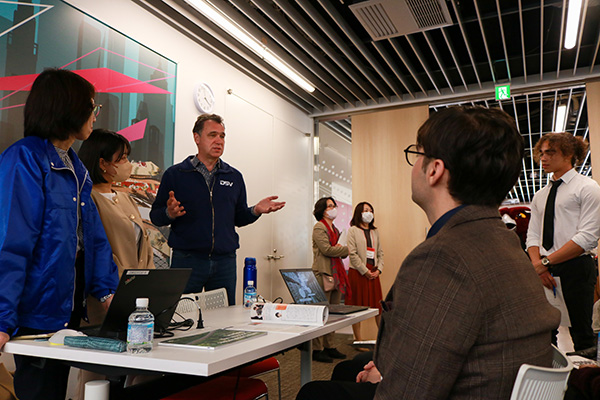 A TUJ student engages with corporate staff at the career fair.