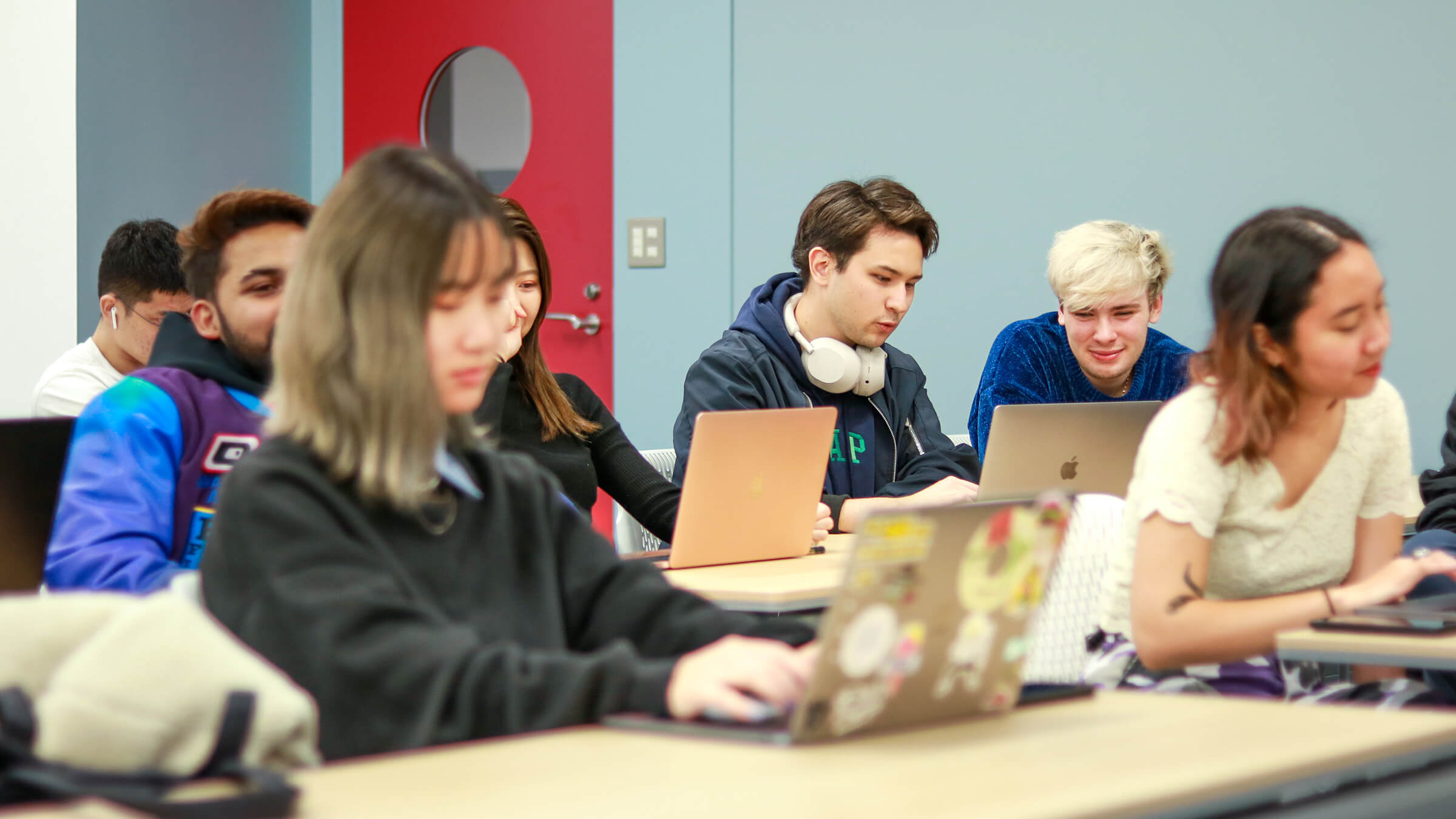 Students studying together in a class on TUJ campus.