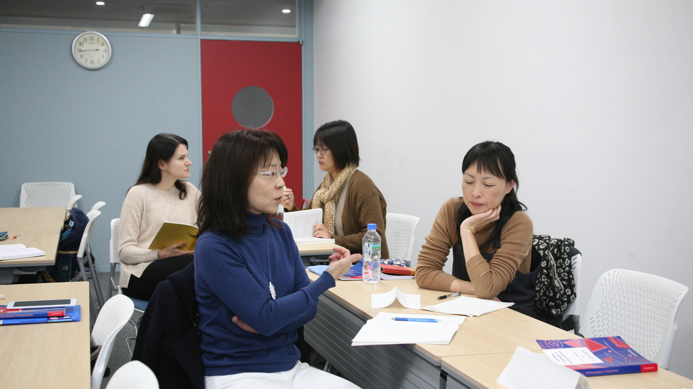 Students hold discussions in a continuing education course at TUJ's campus in Tokyo.
