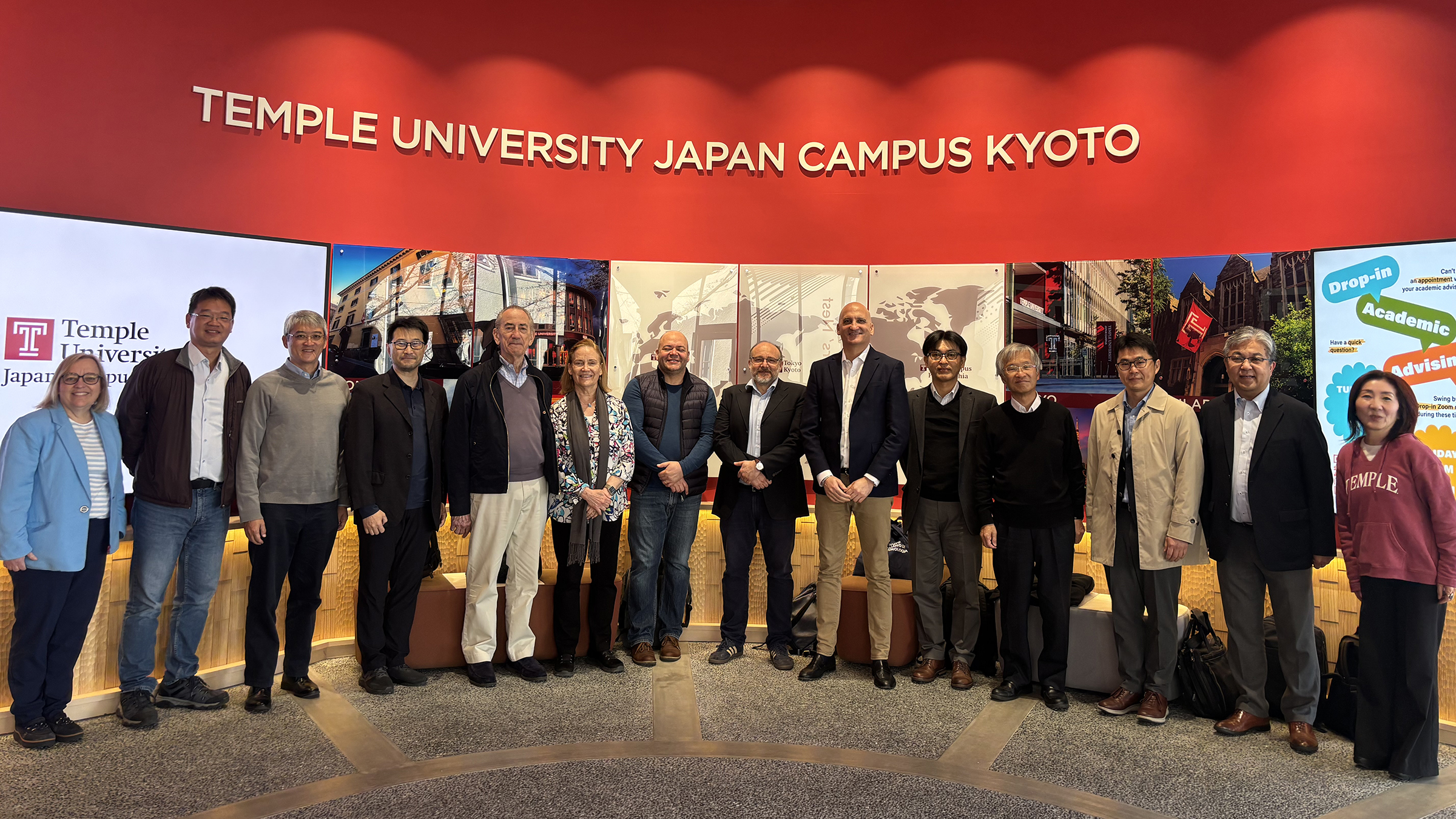Conference participants gather at the entrance of TUJ Kyoto